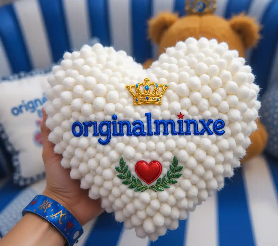 Heart shaped plush toy with royal crown and text
