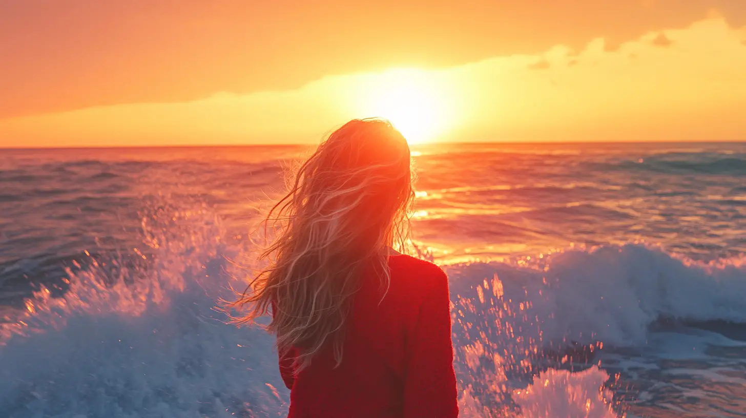 Woman watching sunrise on a serene ocean beach