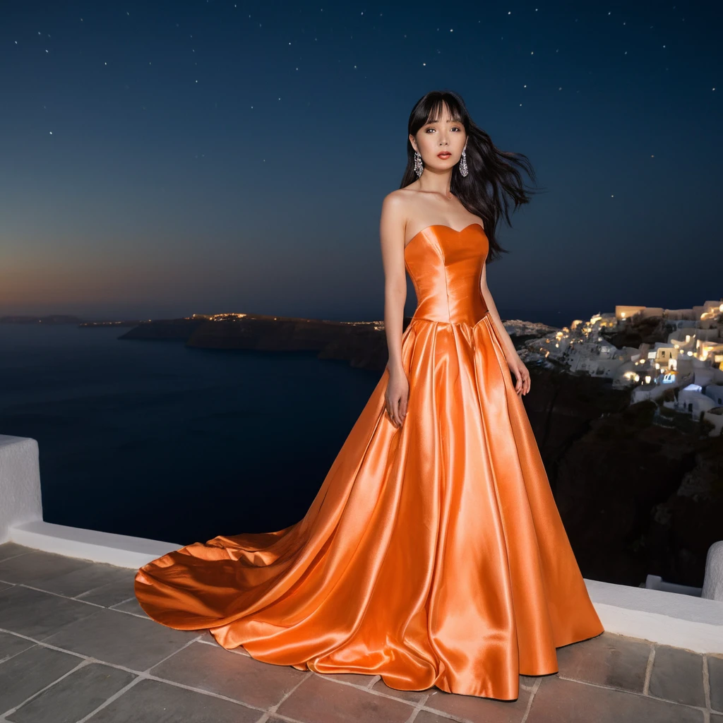 Elegant woman in orange satin gown at night in Santorini