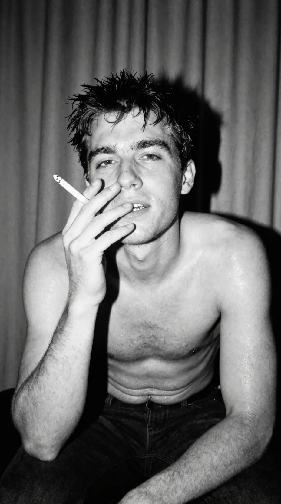 Gritty black and white portrait of a man smoking
