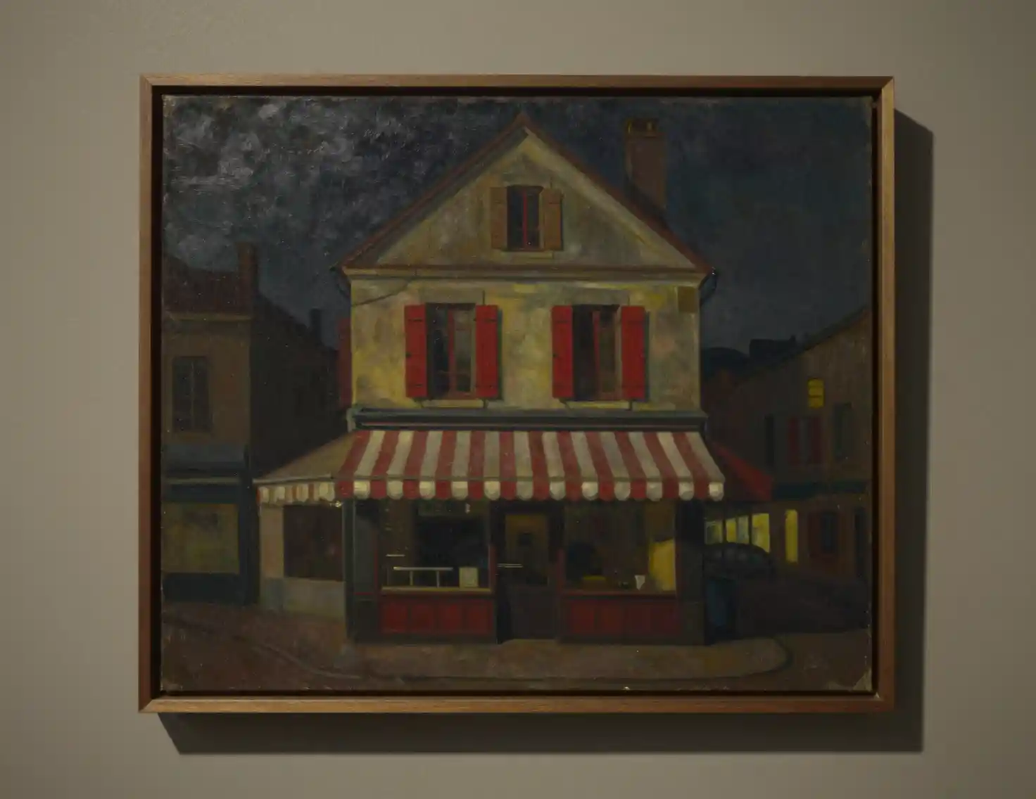 Framed painting of a nostalgic storefront at night
