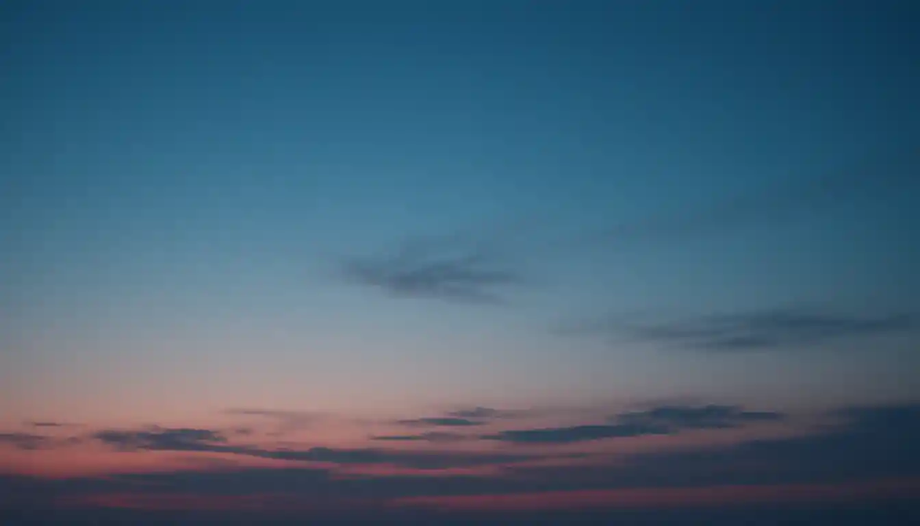 Dark Blue Gradient Sky With Thin Clouds Background