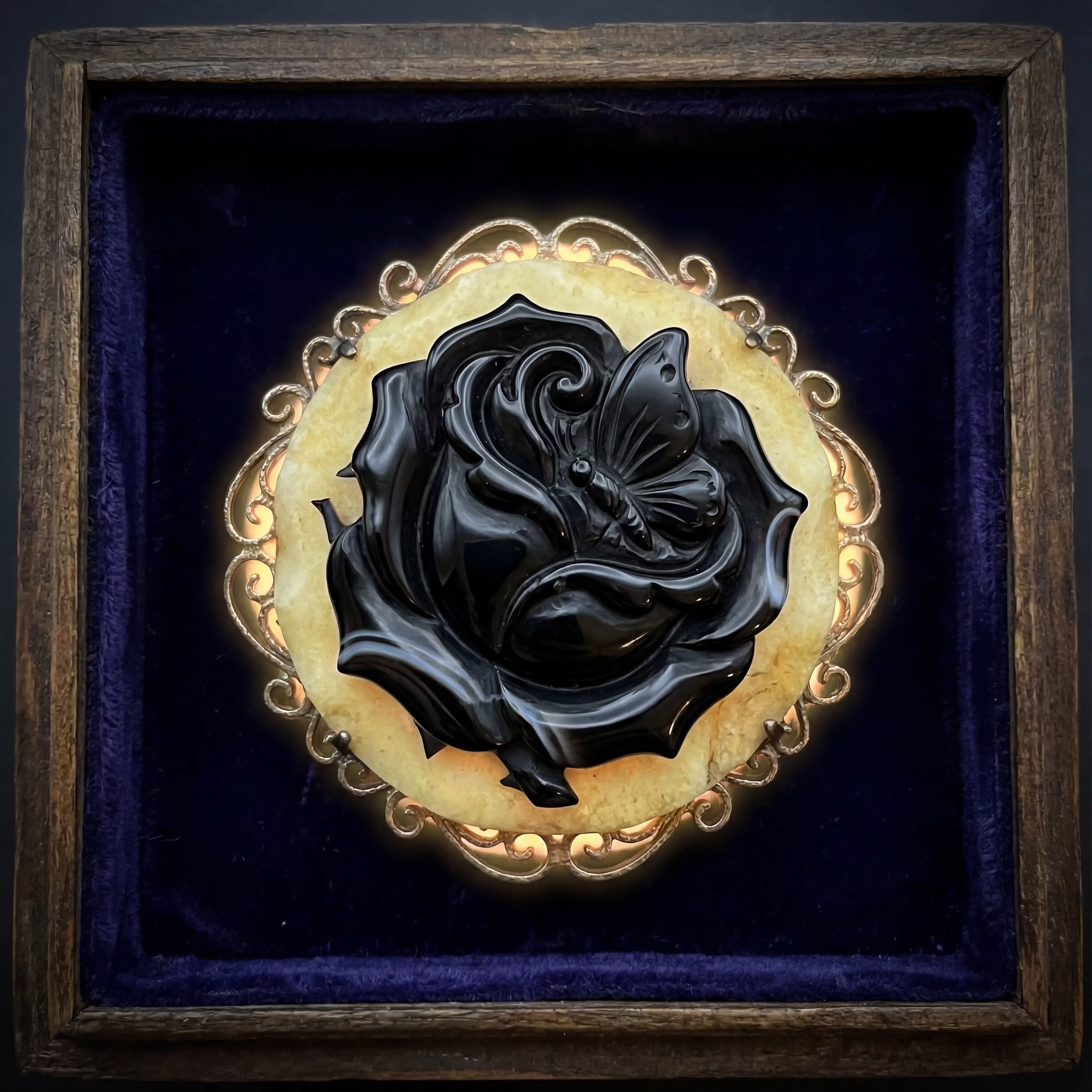 Onyx cameo brooch with thorny rose and butterfly