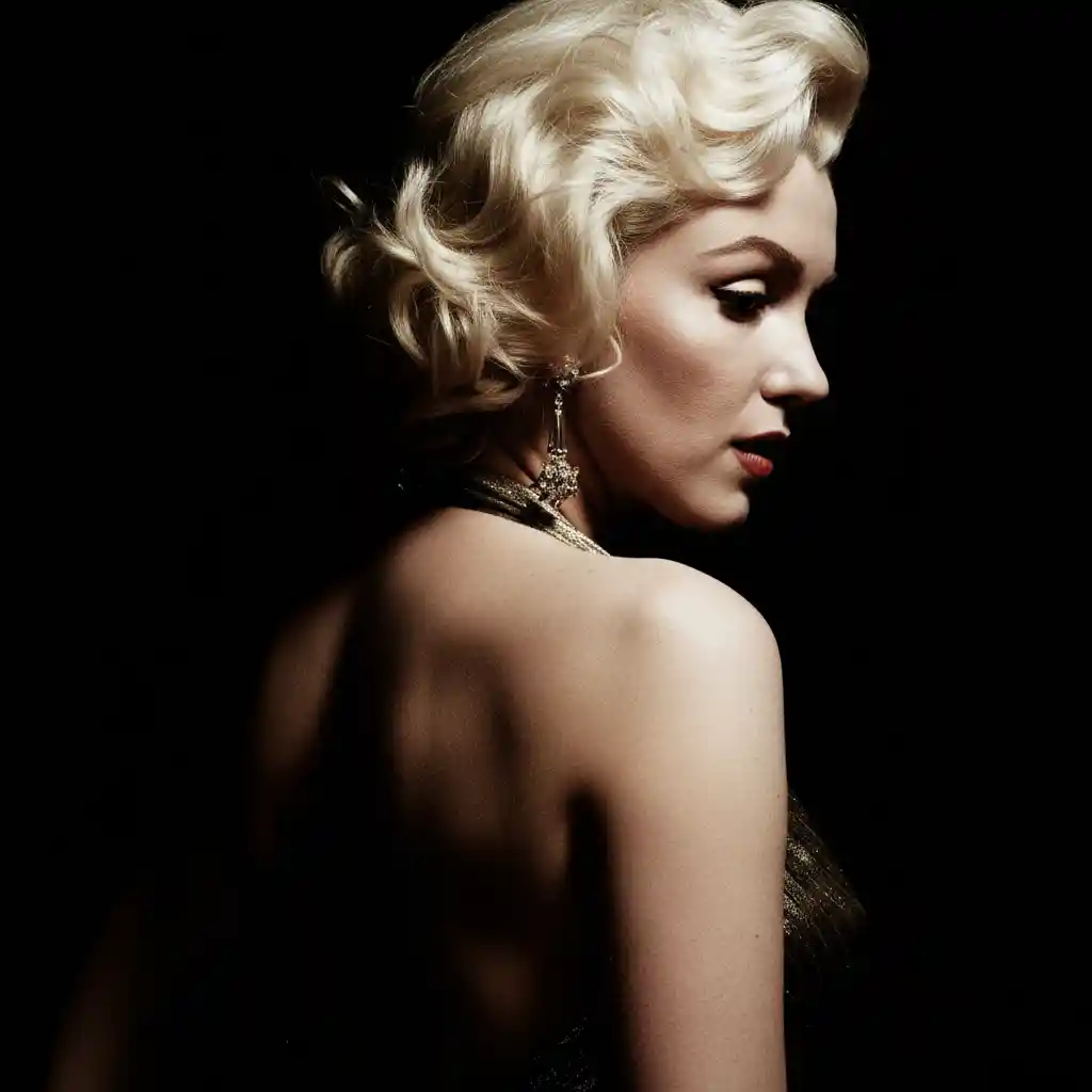 Dramatic rim lit female profile in a gold dress