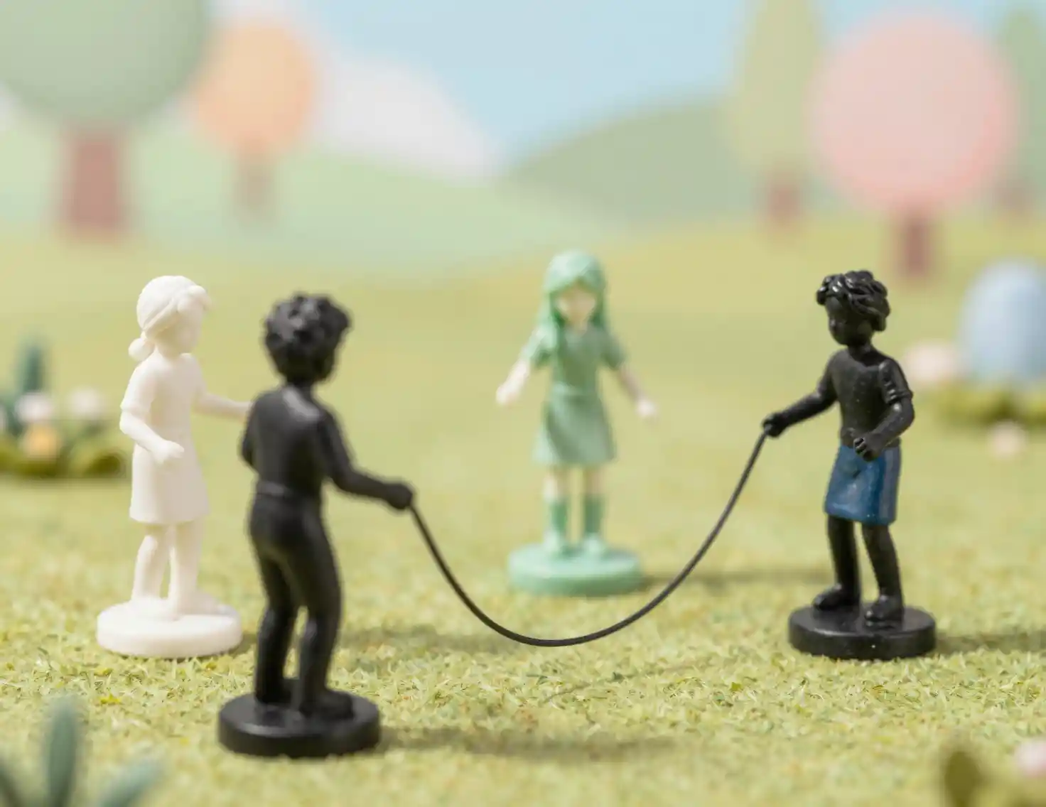 Children Jump Rope Among Marble Statues In Soft Meadow