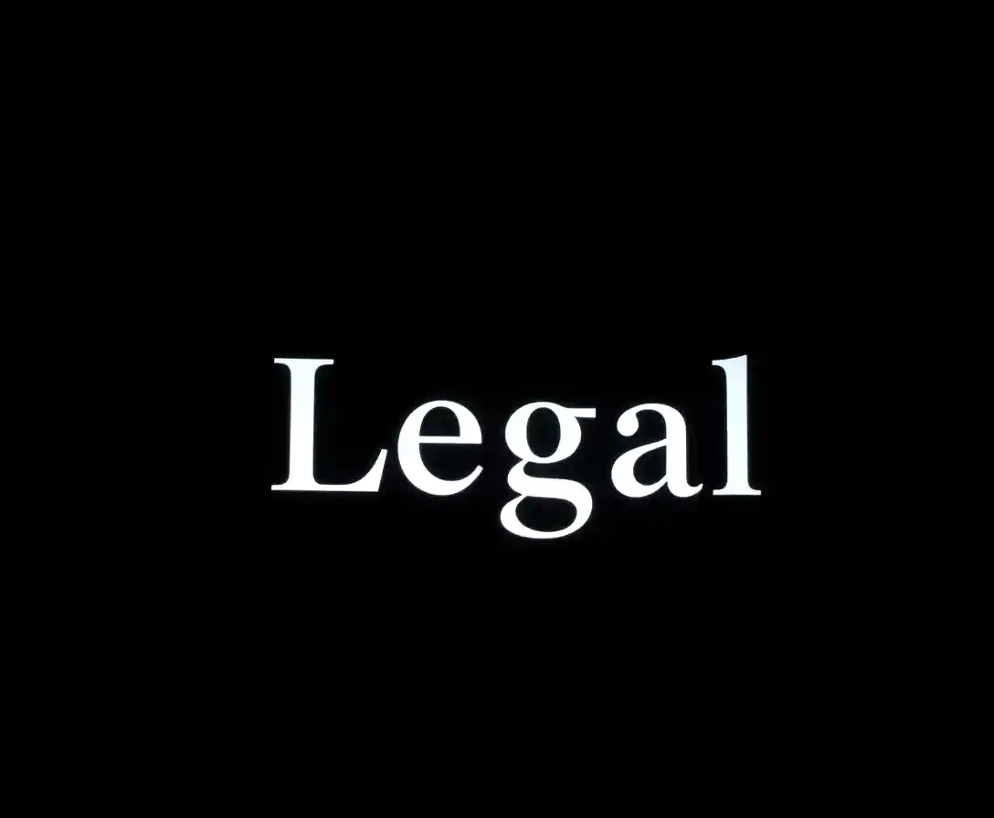 Single illuminated legal text in a dark dramatic scene