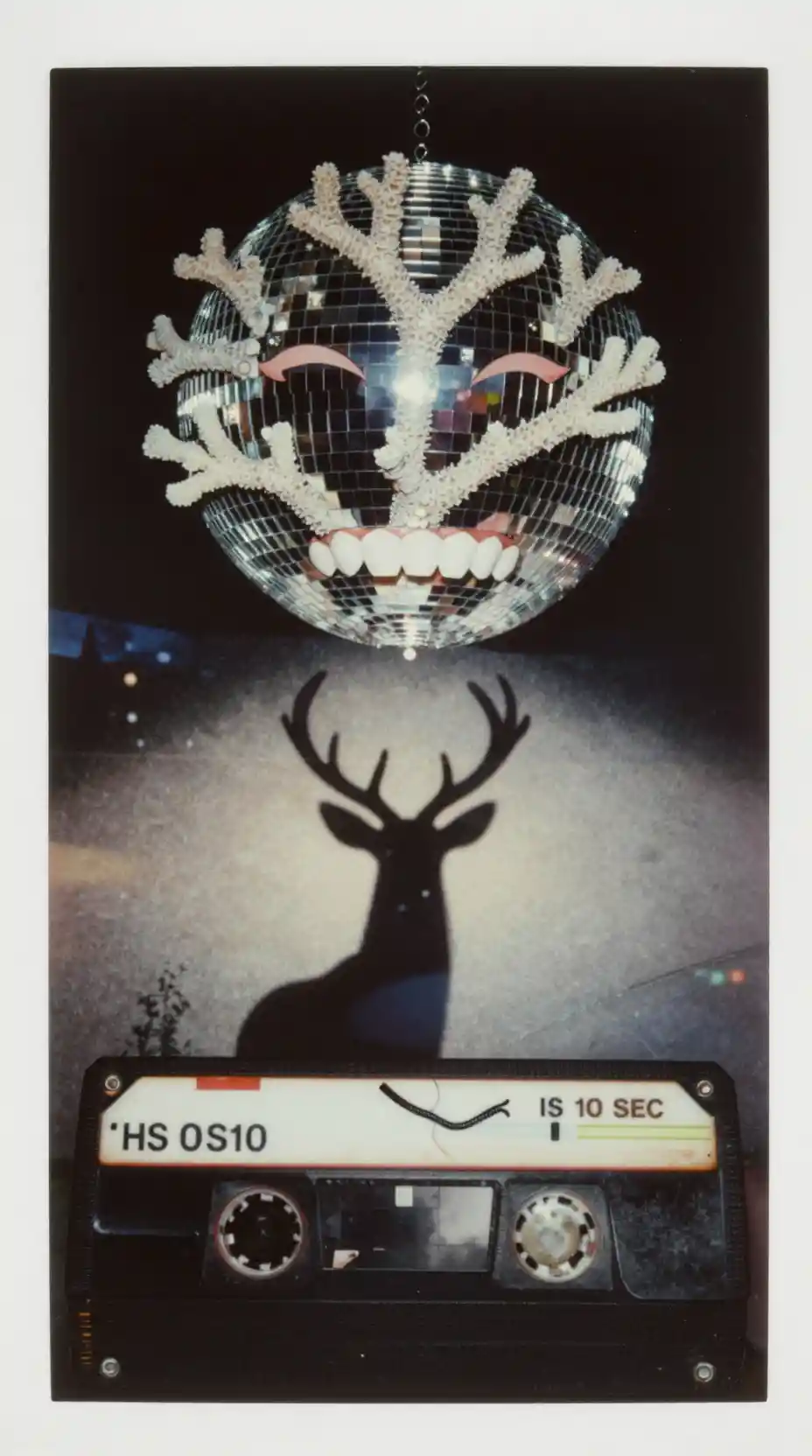 Surreal plastic deer against a mint night sky horizon