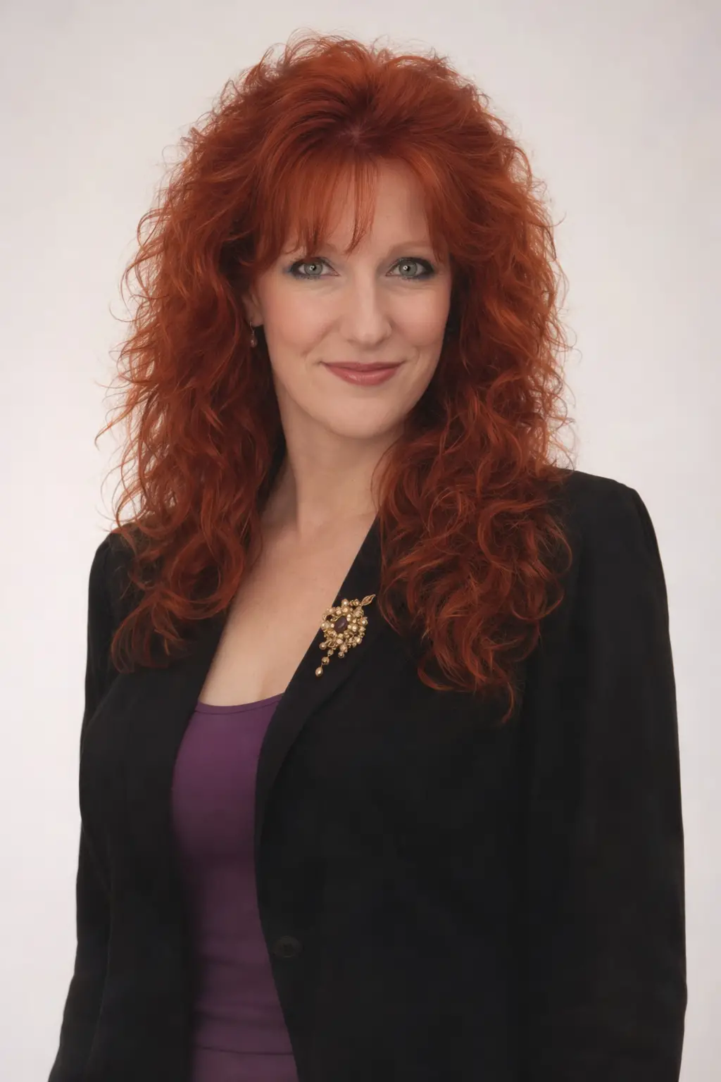 Red haired girl in studio three quarter portrait
