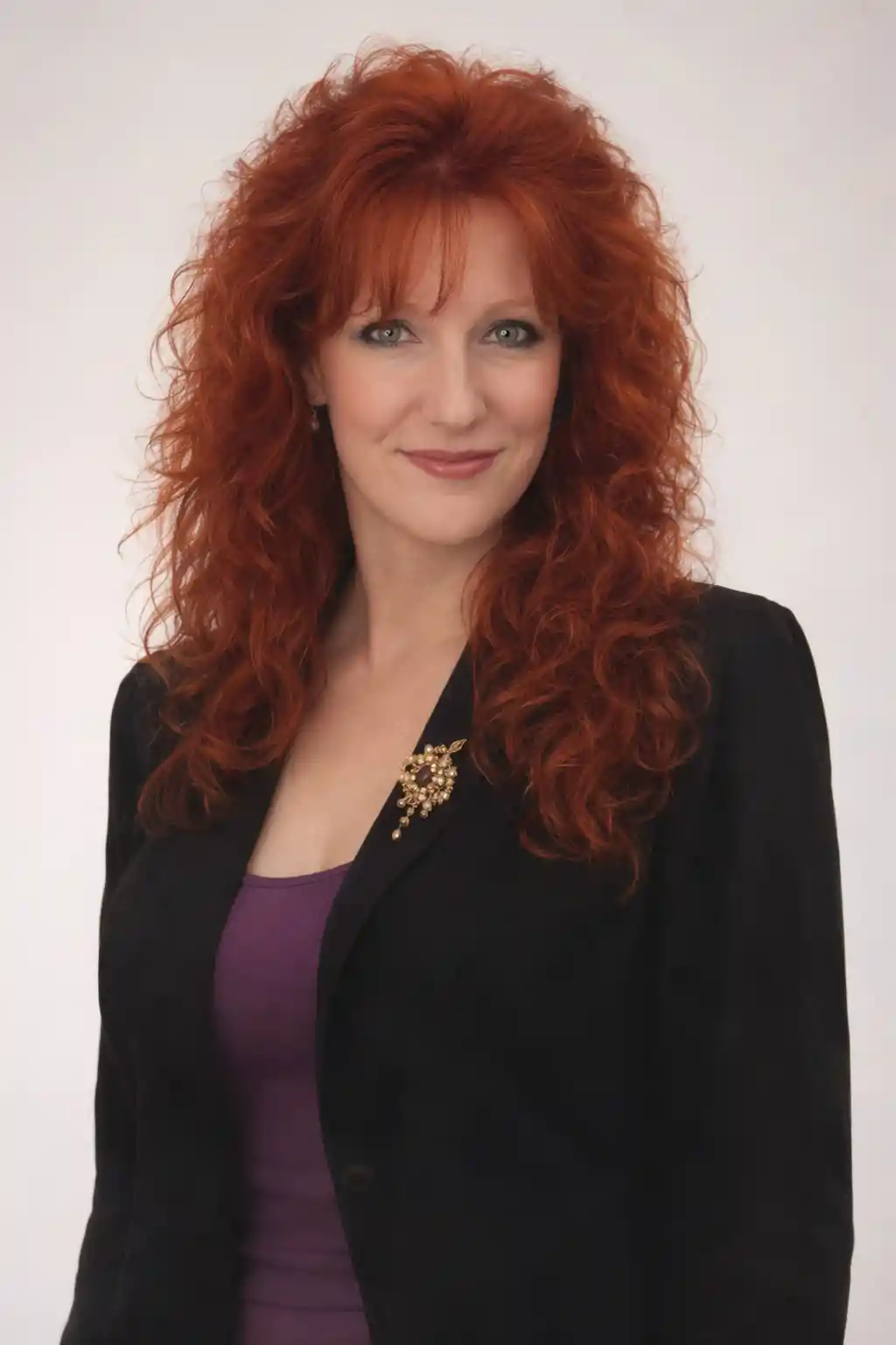 Red haired girl in studio three quarter portrait