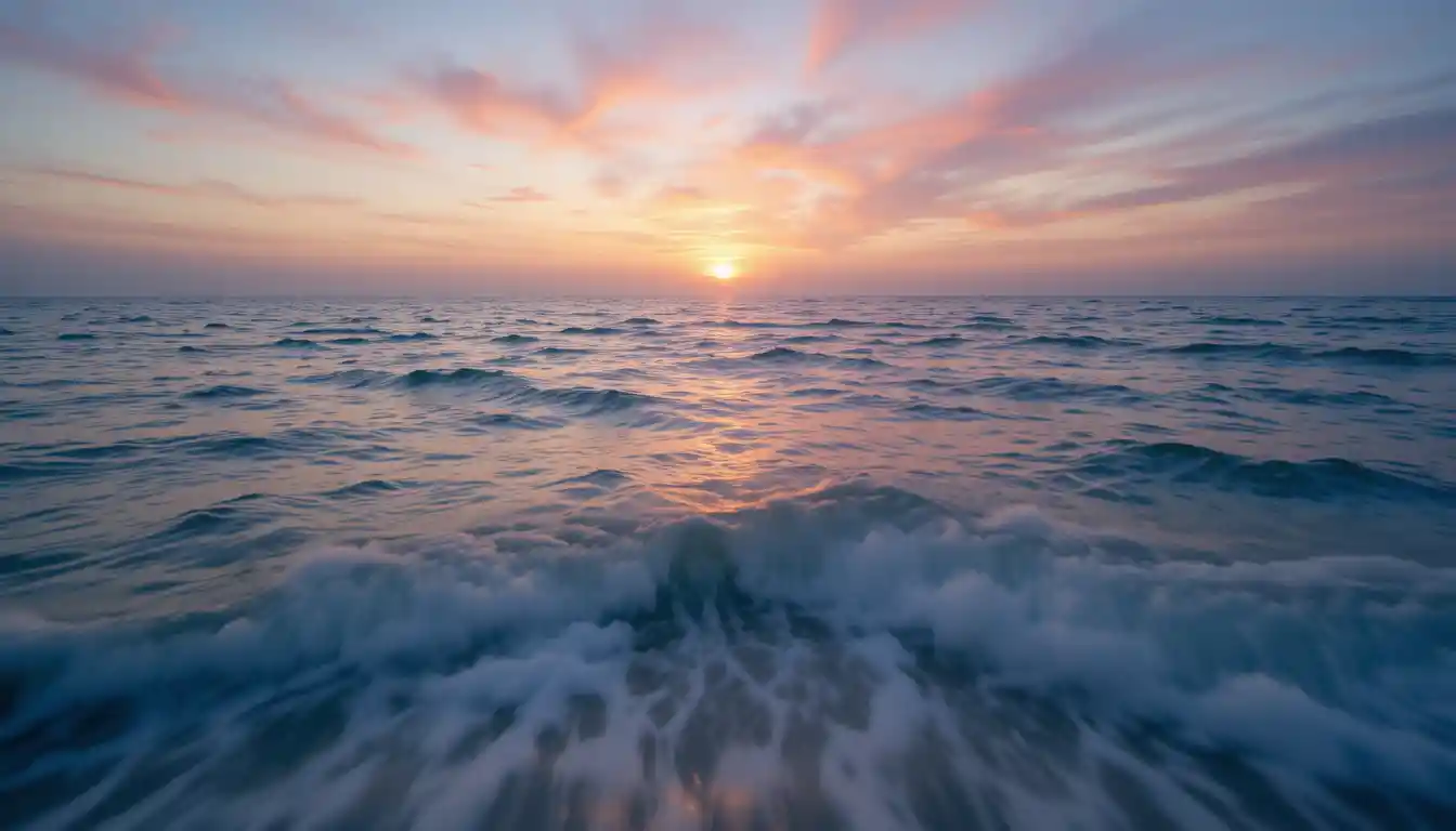 Serene ocean horizon at sunset with gentle rolling waves