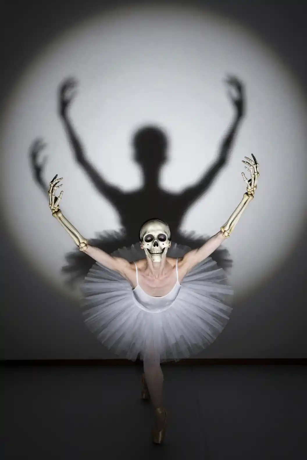 Face seeking clues amid a ballet of skeletal hands