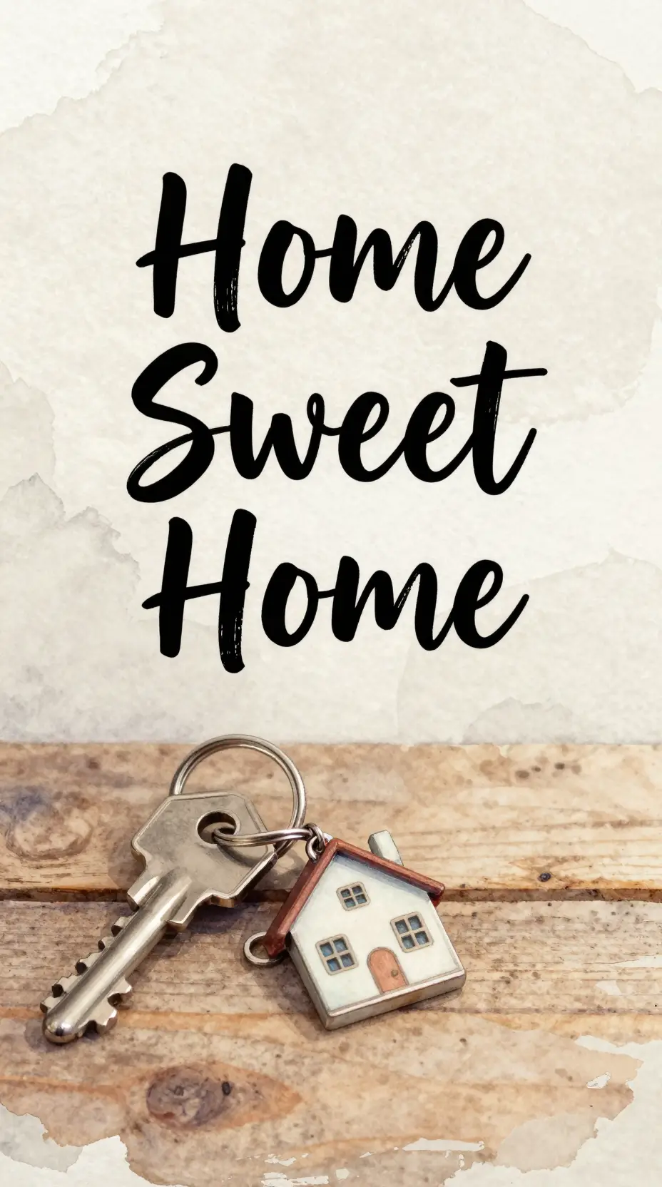 Watercolor key and house keychain on warm wooden surface