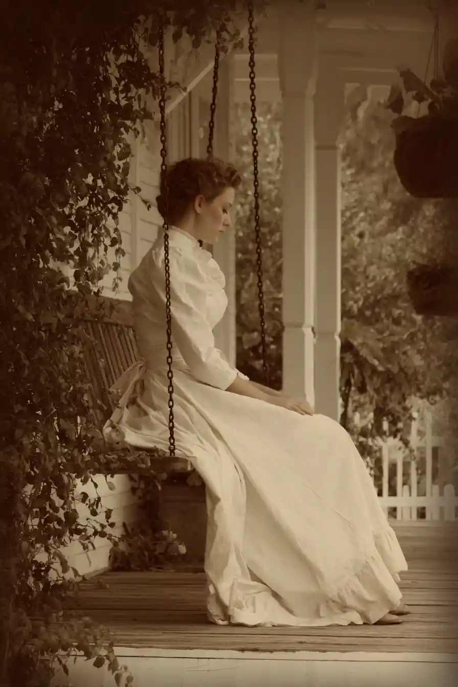 Woman sitting alone on a quiet front porch swing