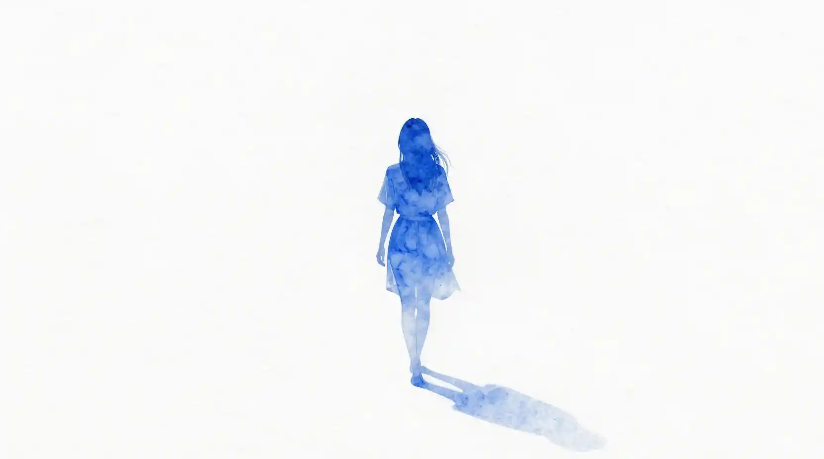 Woman walking away into a vast white abstract space