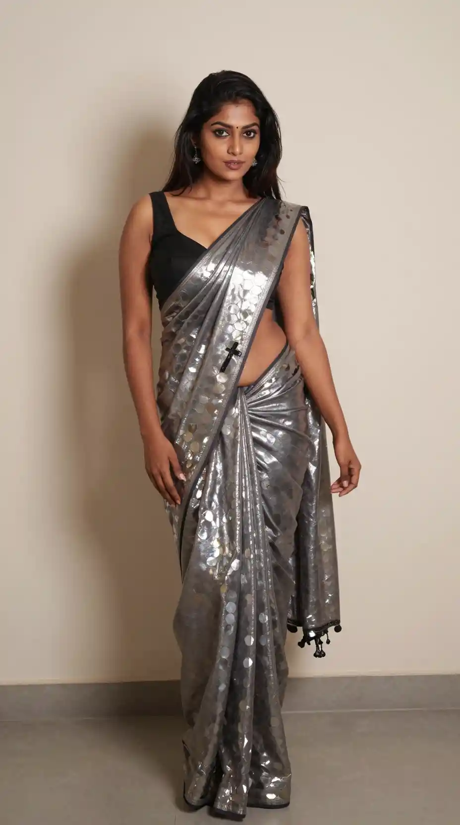 Tamil woman in modern saree posing against a wall