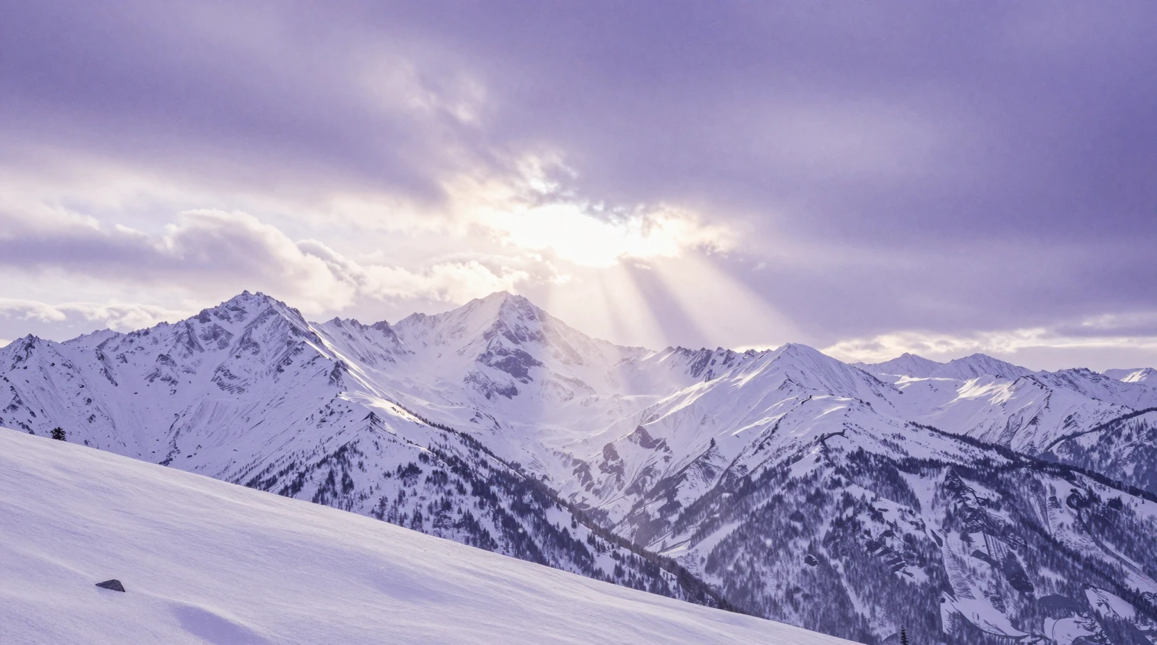 Wide mountain range at dawn with soft moonlit rays