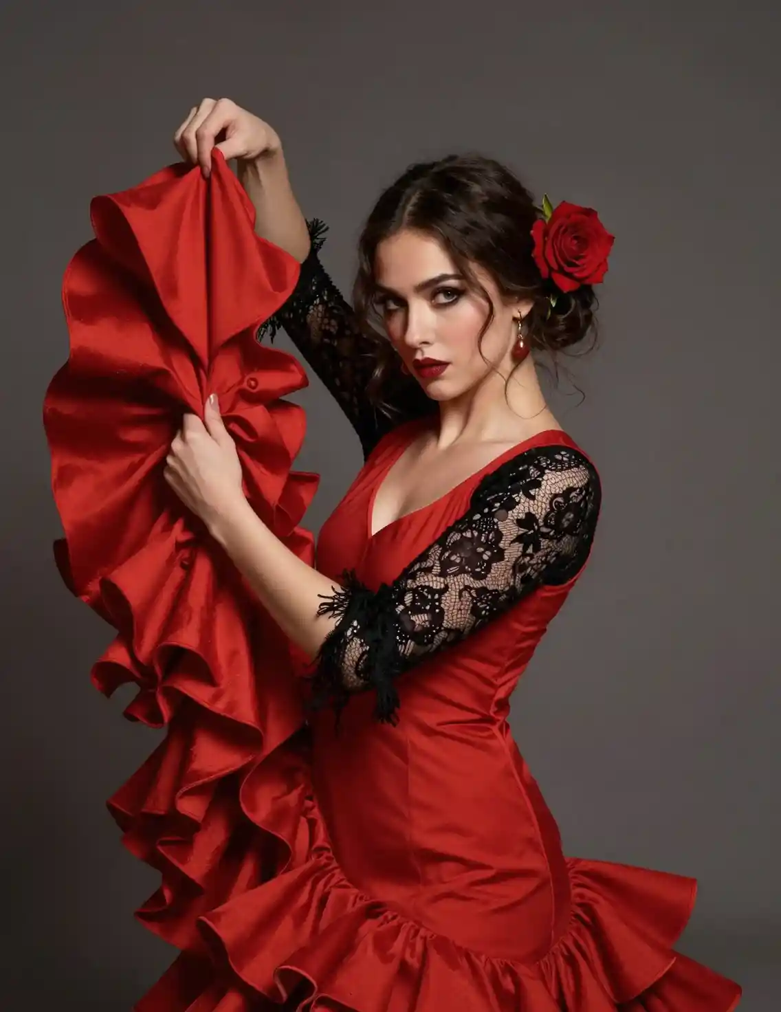 Flamenco dancer in red dress with rose and lace sleeves