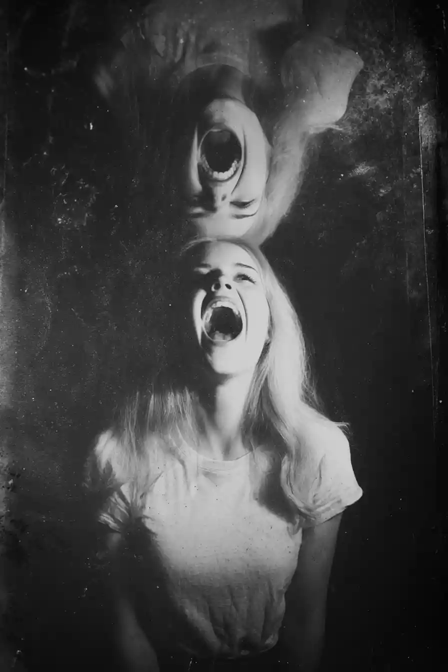 Black and white woman screaming with surreal mirrored head