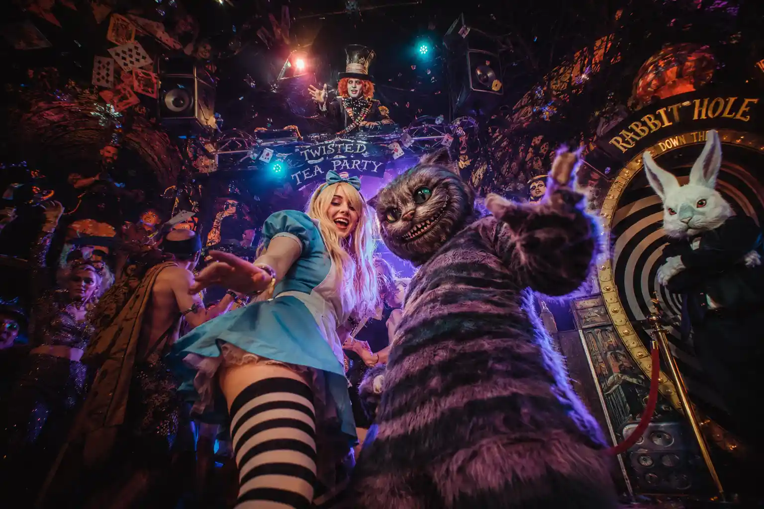 Surreal rave with Alice and the grinning cat dancing wildly