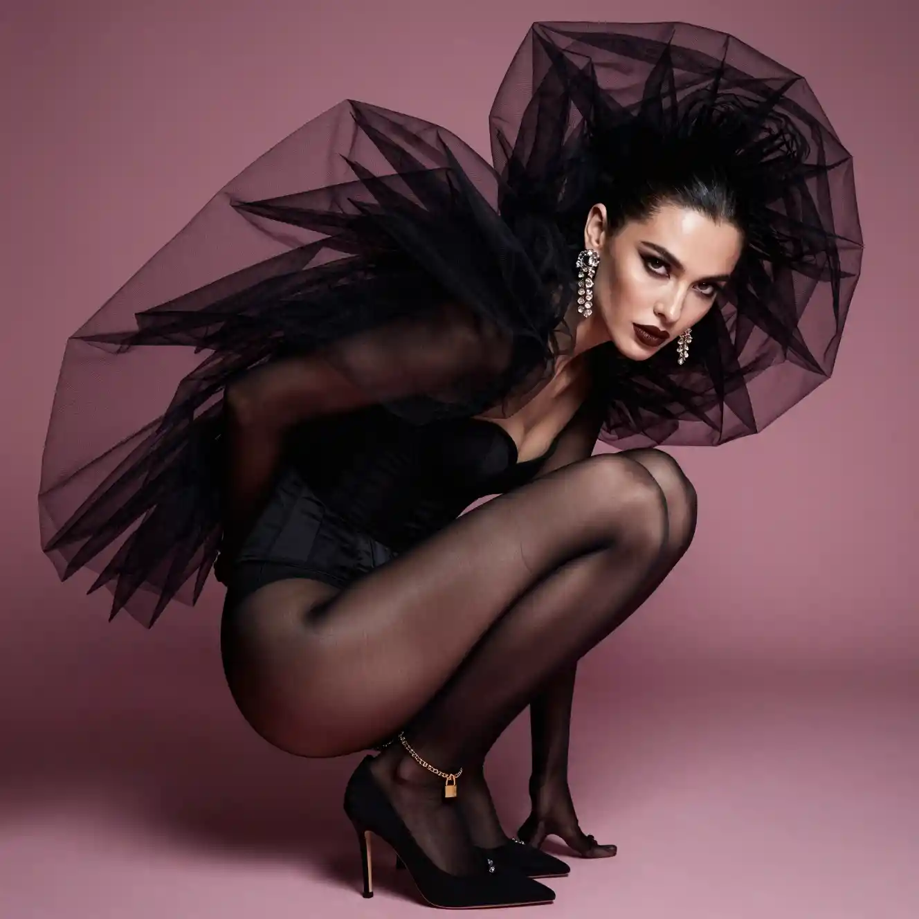 Avant garde fashion portrait of a crouching woman