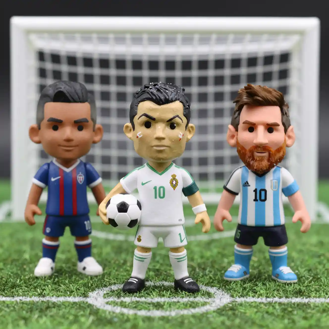 Collectible soccer figurines on a mini football pitch