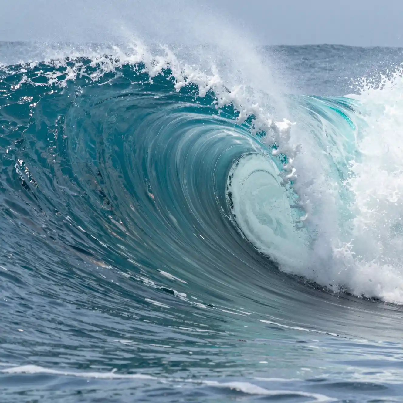 Colossal ocean wave made of countless miniature curling waves