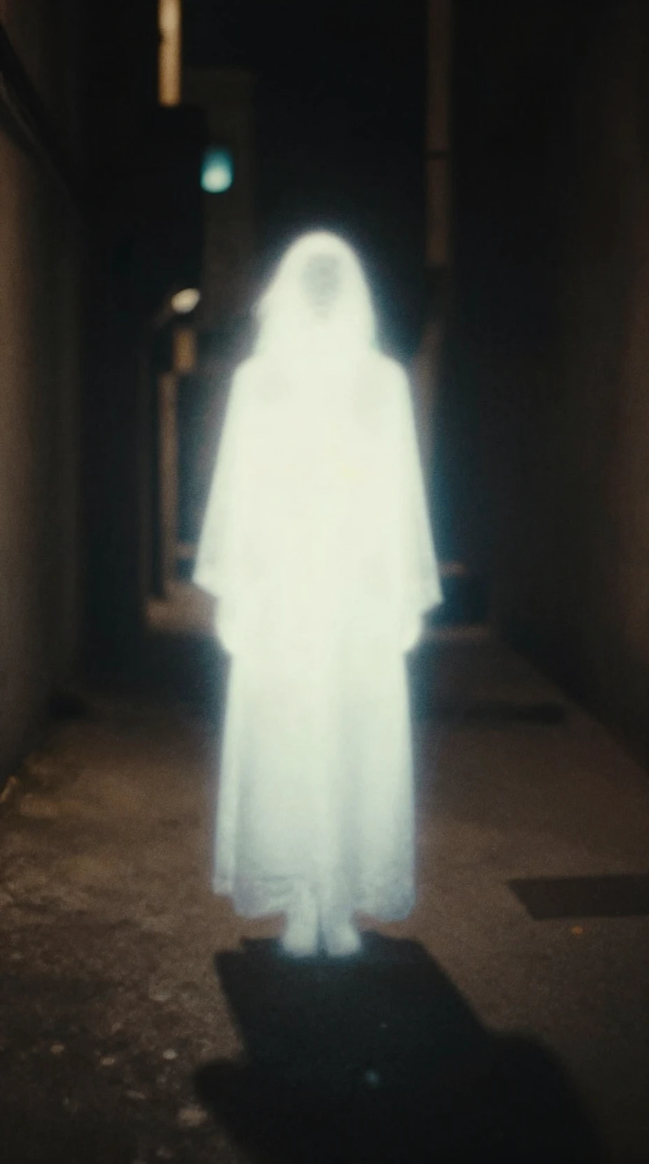 Luminous ethereal figure hovering above a dark city alley
