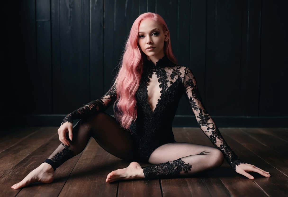 Woman in wide split pose on dark wooden floor