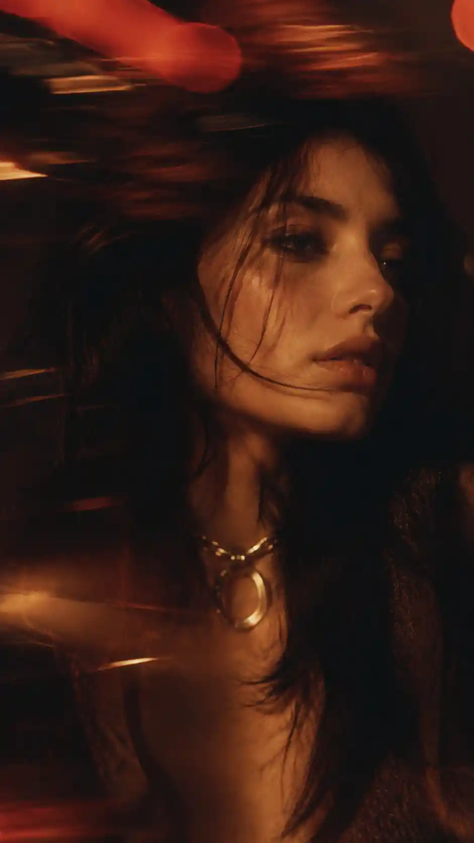 Golden hour fashion portrait of a woman by a window