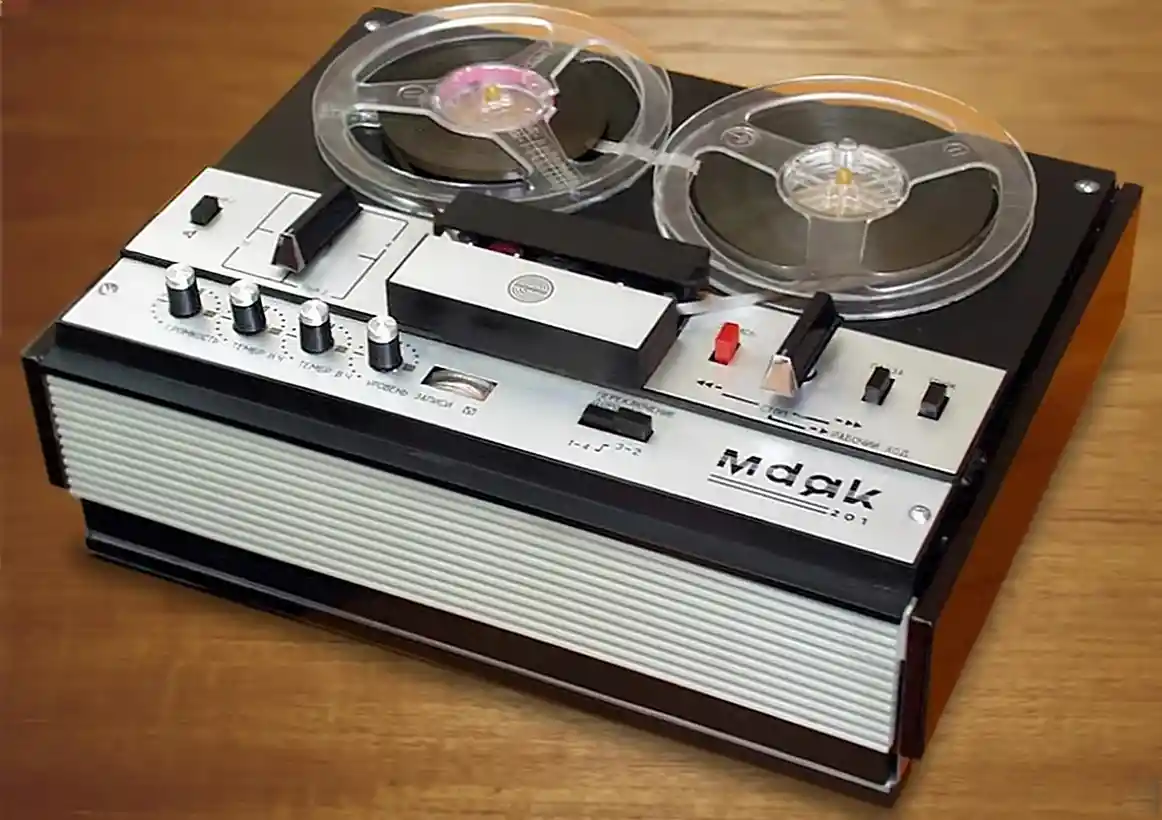 Vintage reel to reel tape recorder with black and silver design