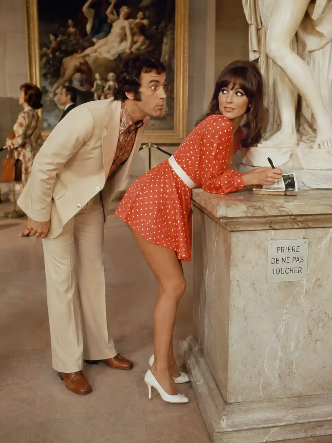 Playful woman in a paris museum comedy inspired scene