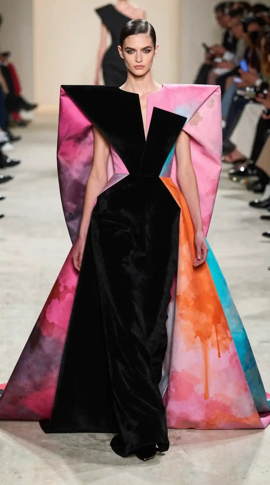 Wide fashion shot of a woman in an architectural gown