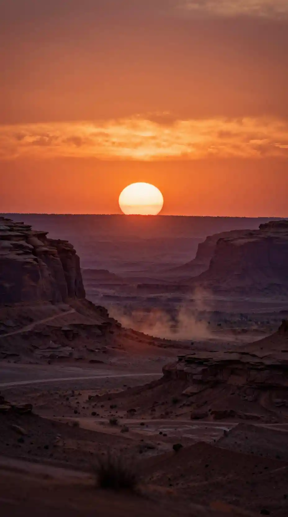 Cinematic desert sunset over mesas and distant canyons