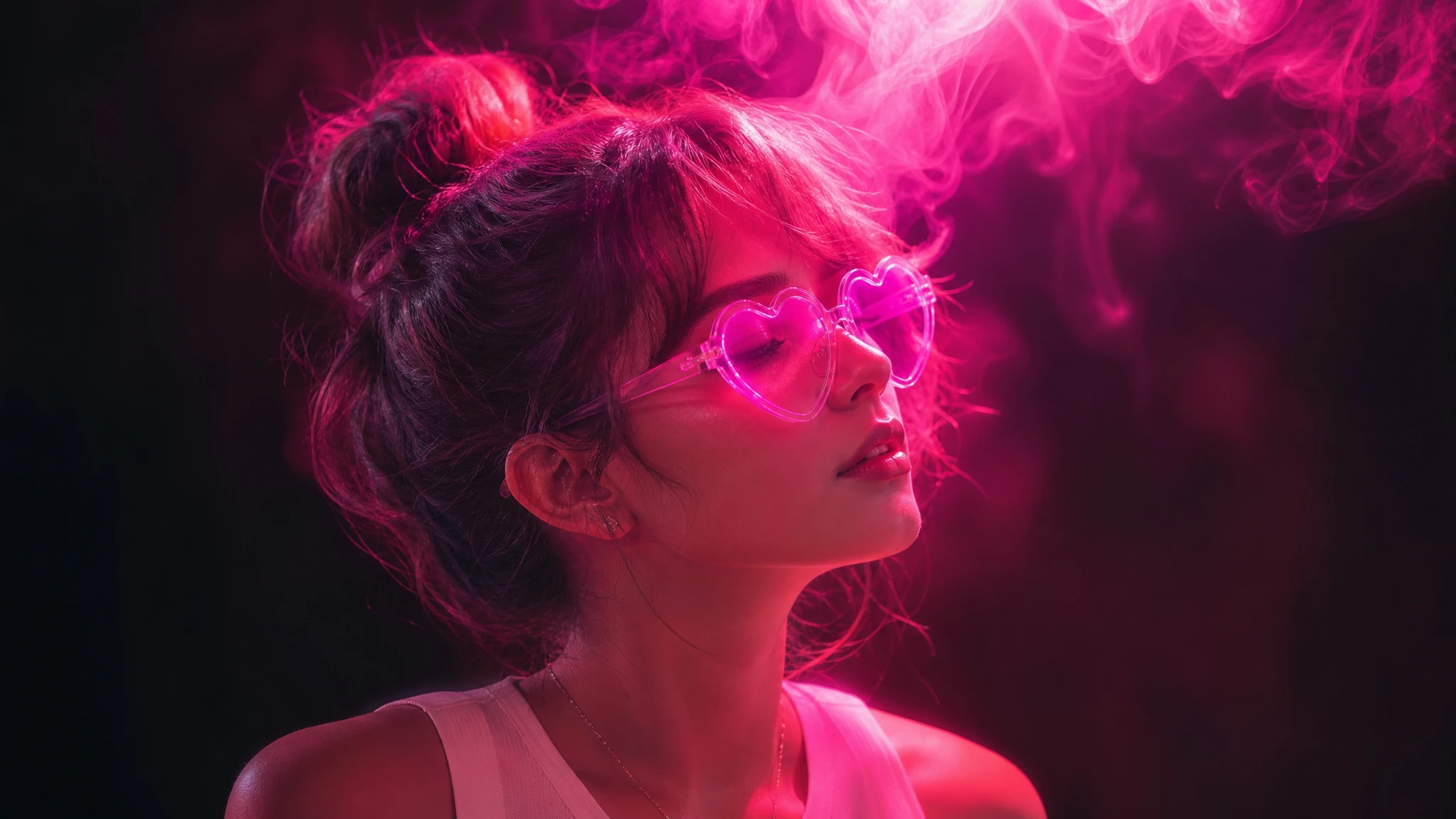 Woman in neon pink and purple light with heart glasses