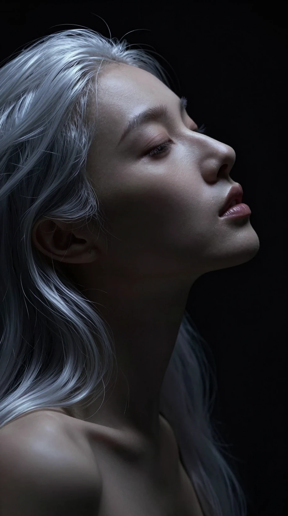 Serene profile portrait of a woman in dramatic chiaroscuro