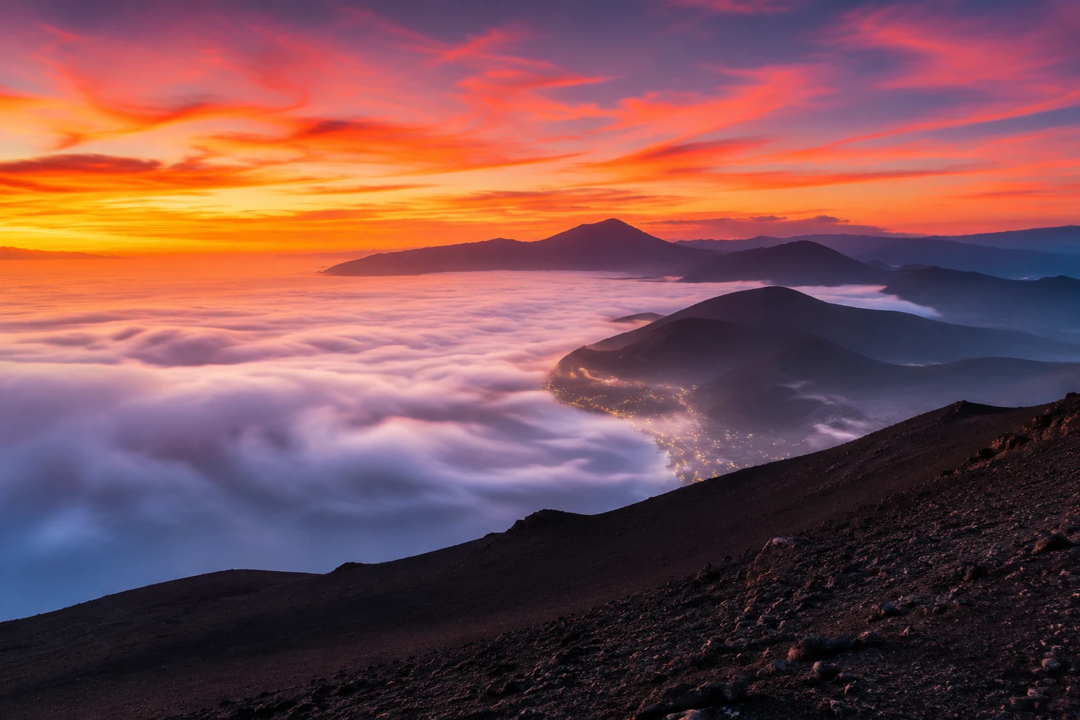 Sunrise mist over distant coastal mountain ranges