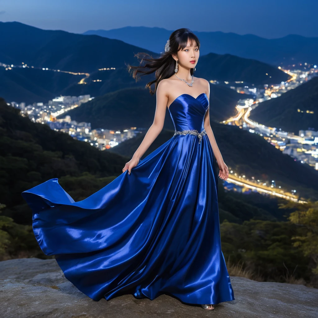 Elegant woman in royal blue satin dress at night