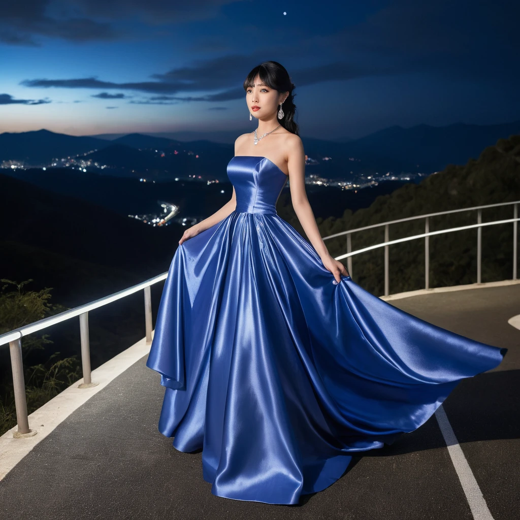 Elegant woman in royal blue satin gown at night