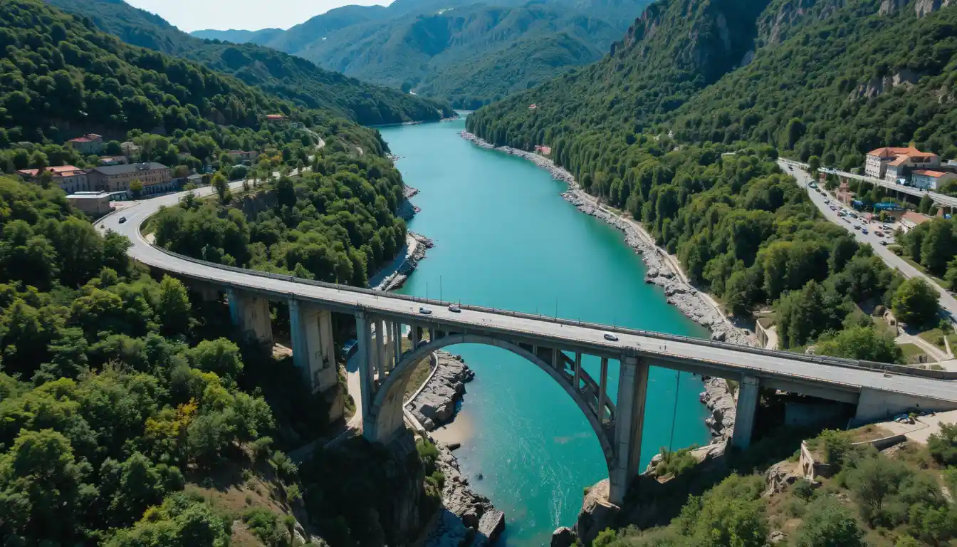Aerial view of twin bridges over a turquoise river