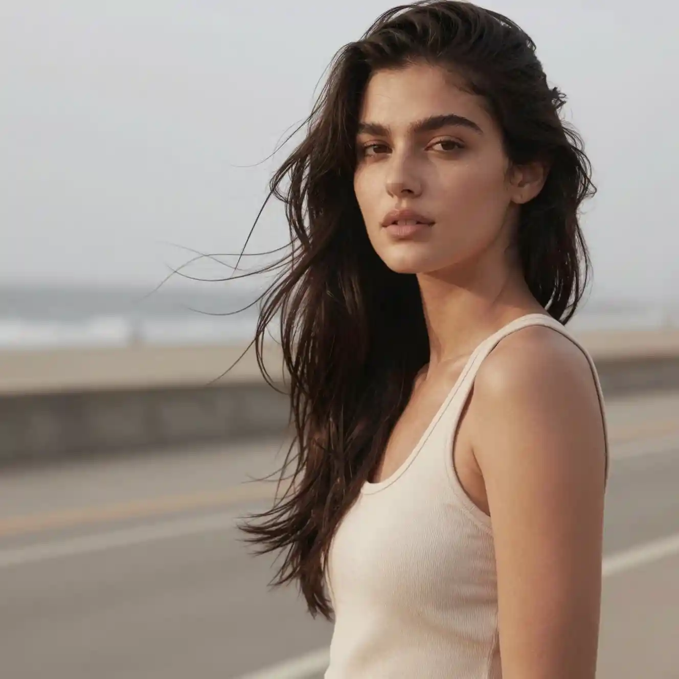 Young woman in relaxed pose in outdoor fashion portrait