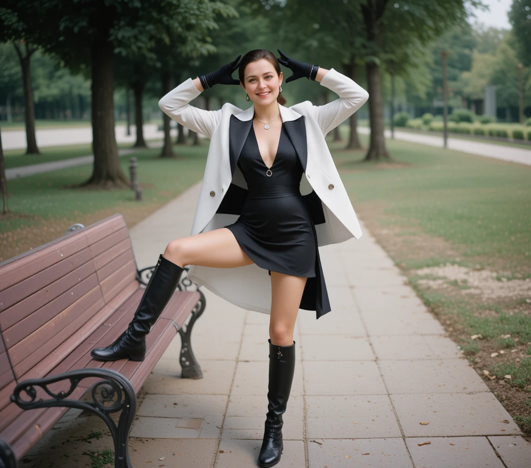 Fashion model posing on bench in black boots and gloves