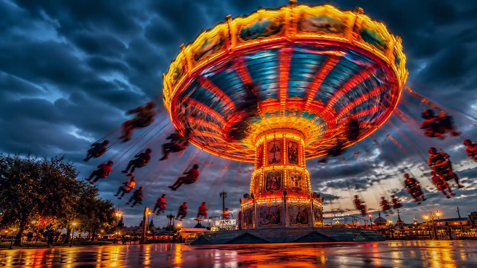 Surreal fairground star ride in vivid long exposure motion