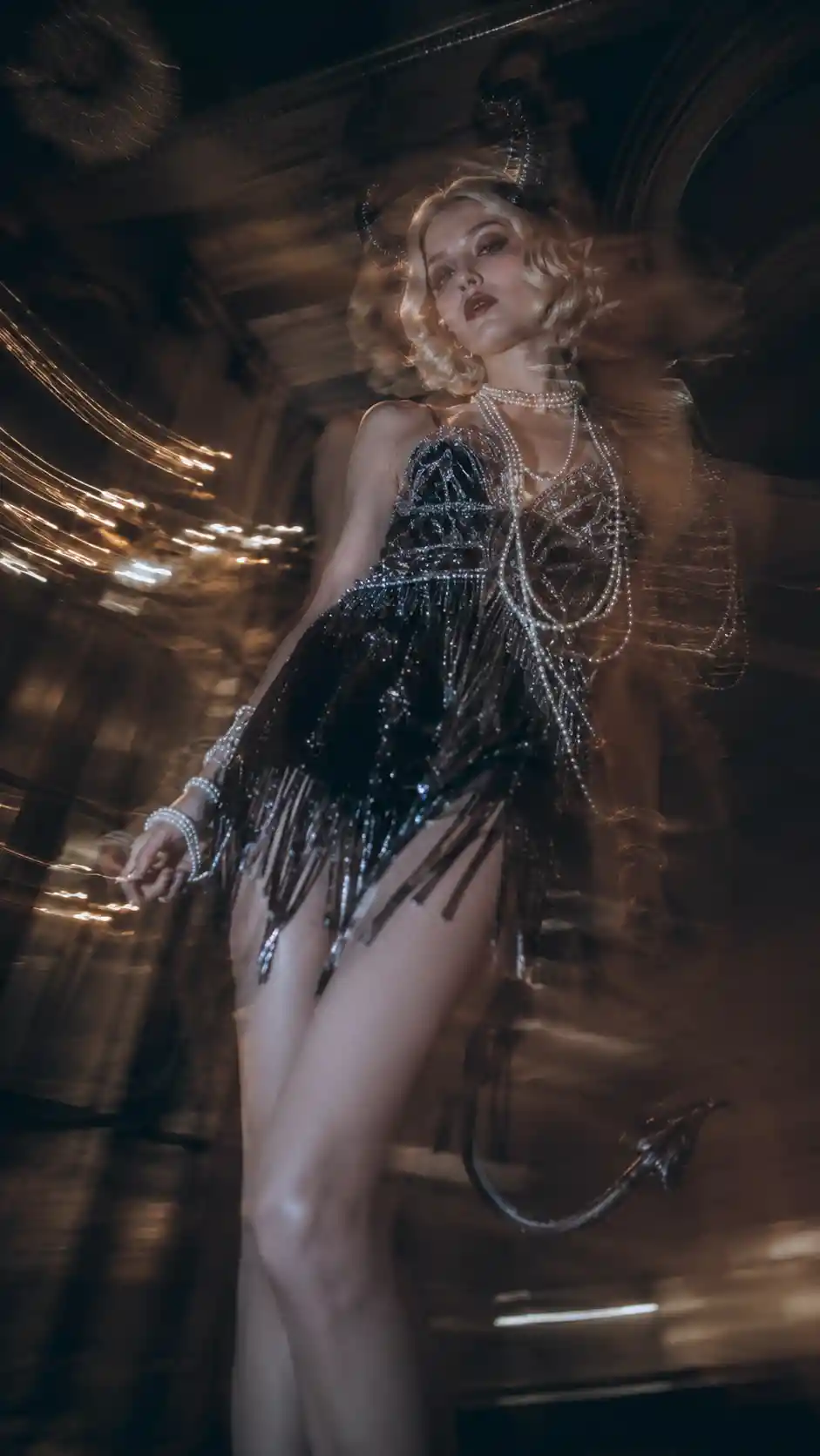 Elegant flapper tiefling woman in a beaded black dress