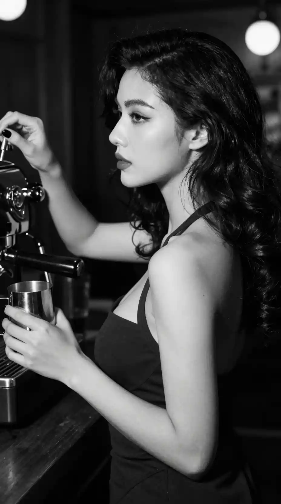Black and white portrait of a woman at a coffee bar