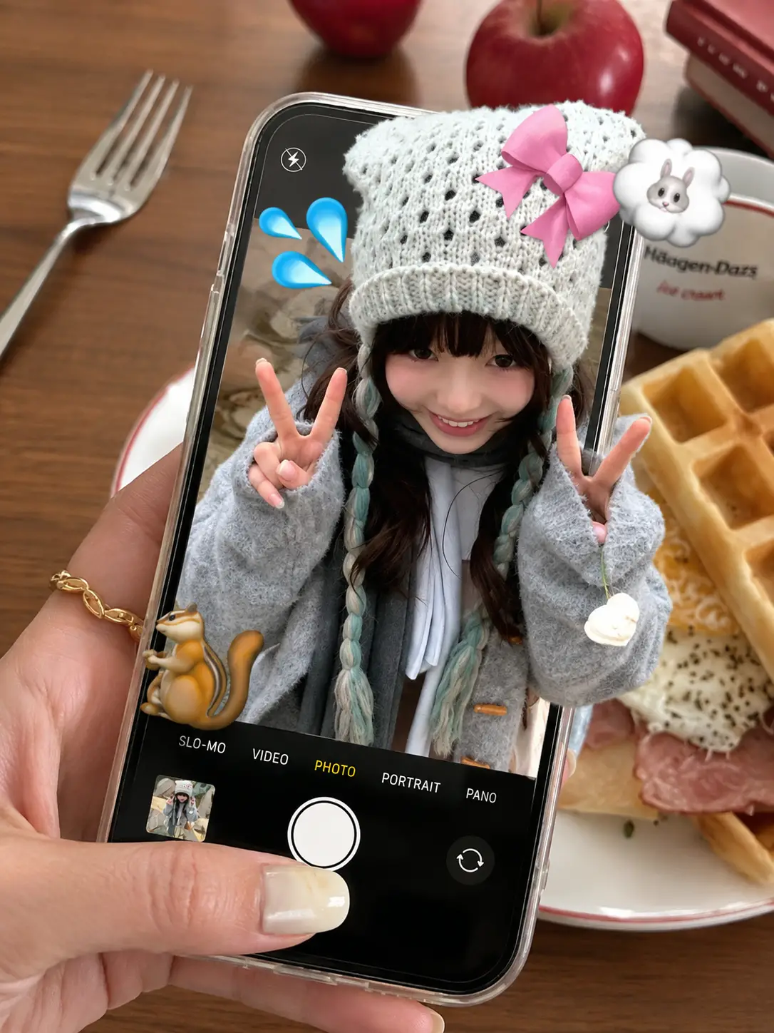 Girl selfie in smartphone above breakfast table