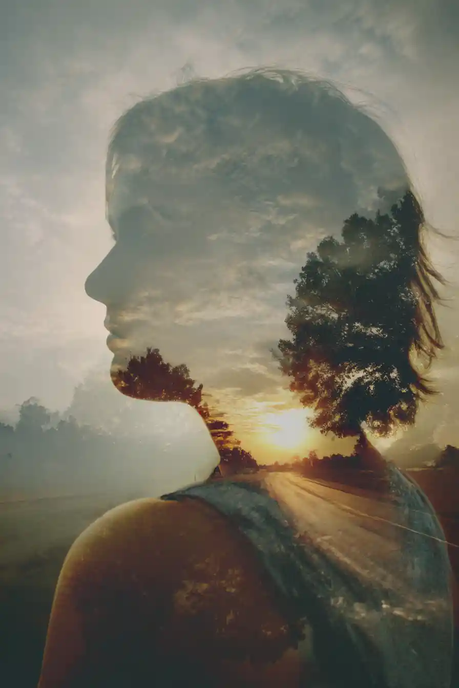Melancholic double exposure of distant horizon and landscapes