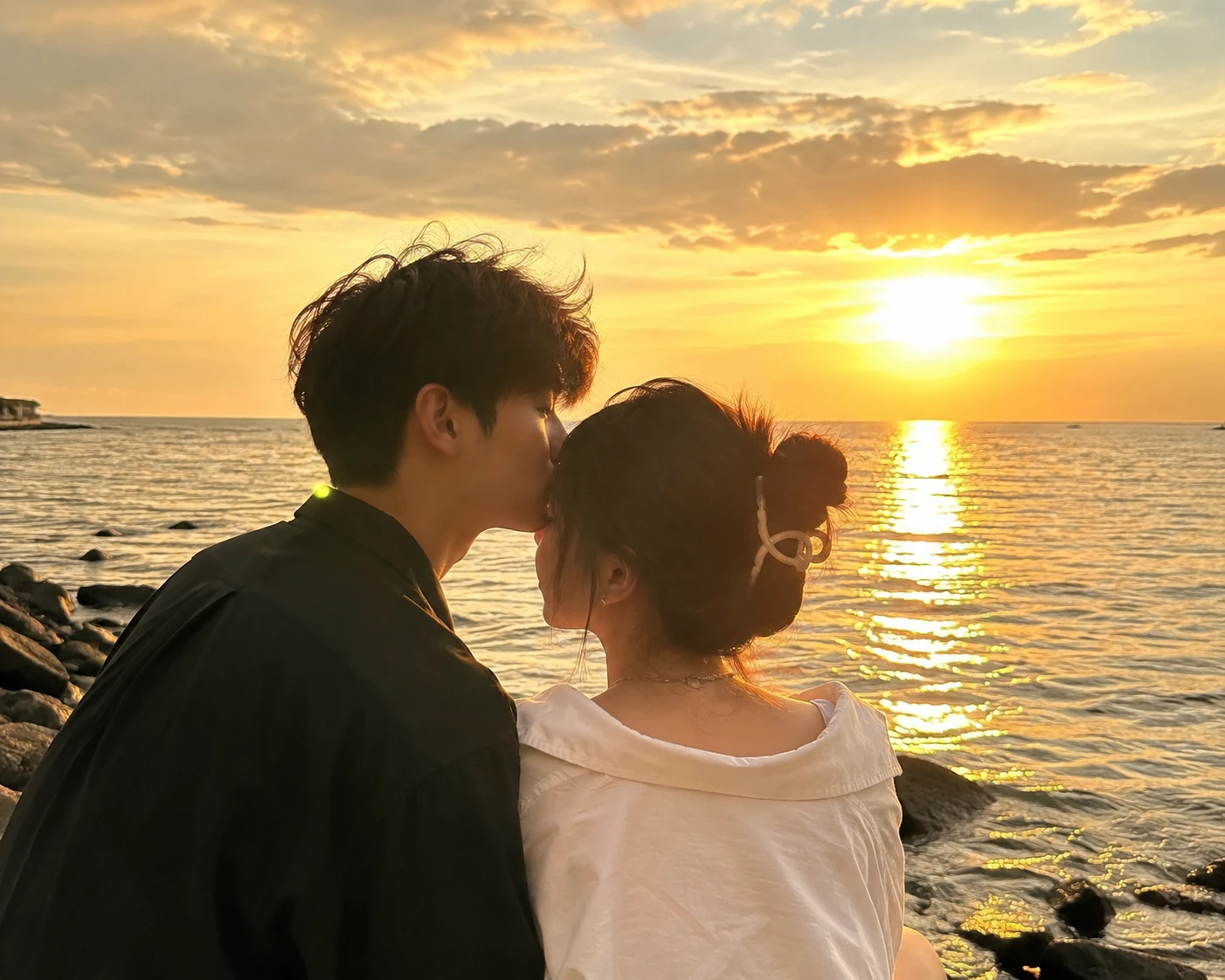 Romantic couple by the sea with warm sunshine glow
