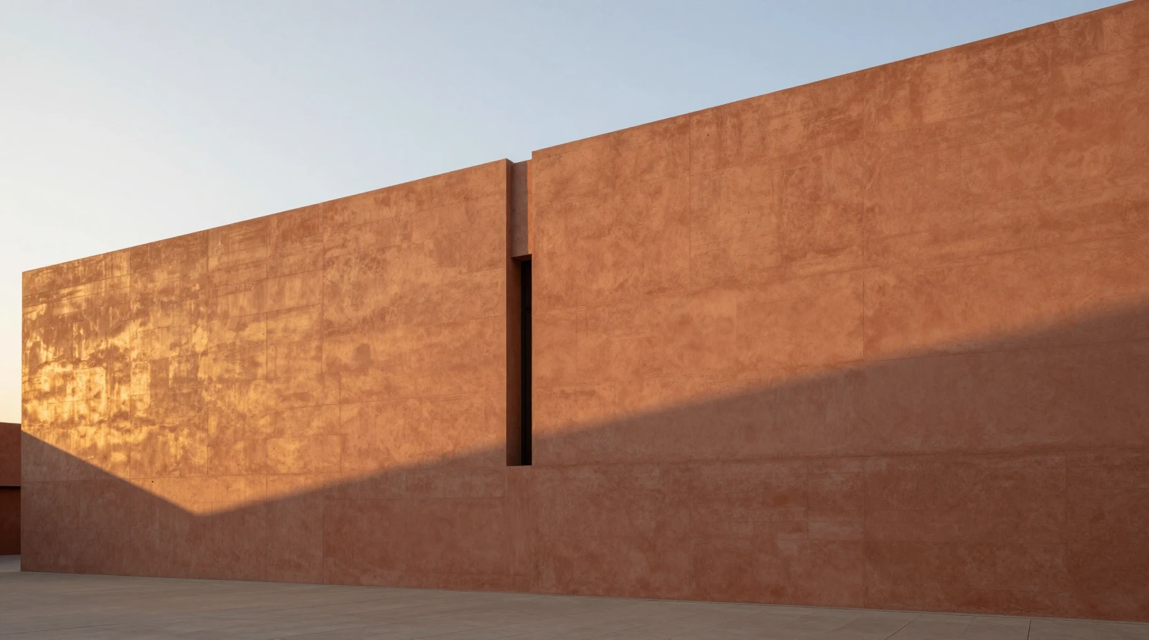 Minimalist ochre facade glowing in warm evening sunlight