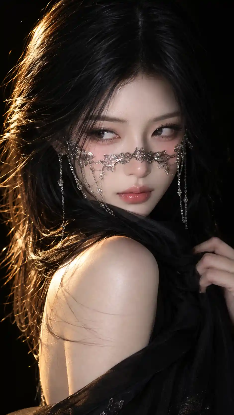 A woman in a silver veil glances over her shoulder against black