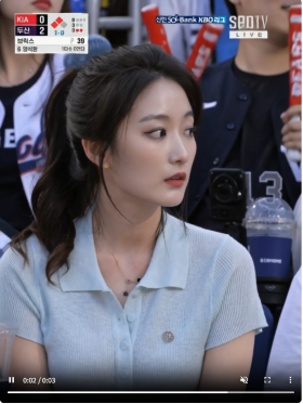 woman watching baseball game